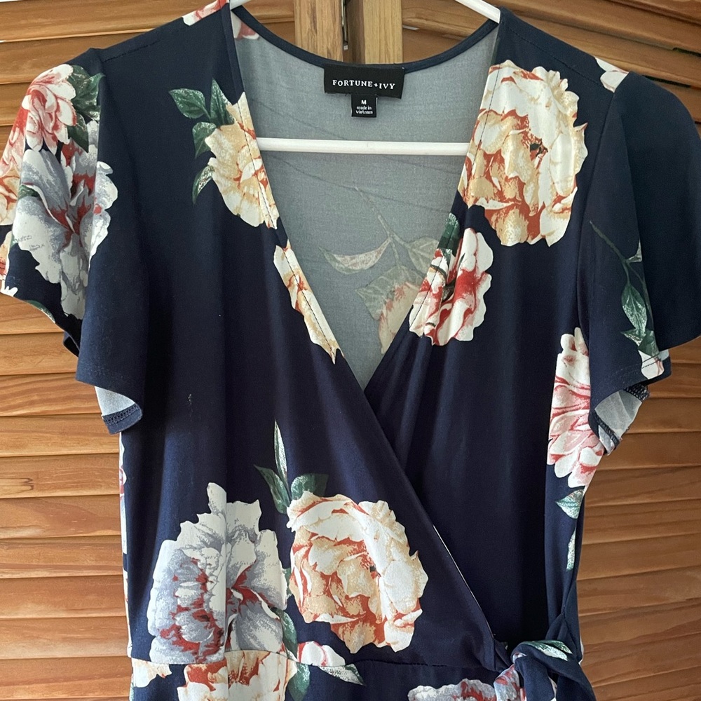 Blue floral knit dress. Faux wrap and high low hem